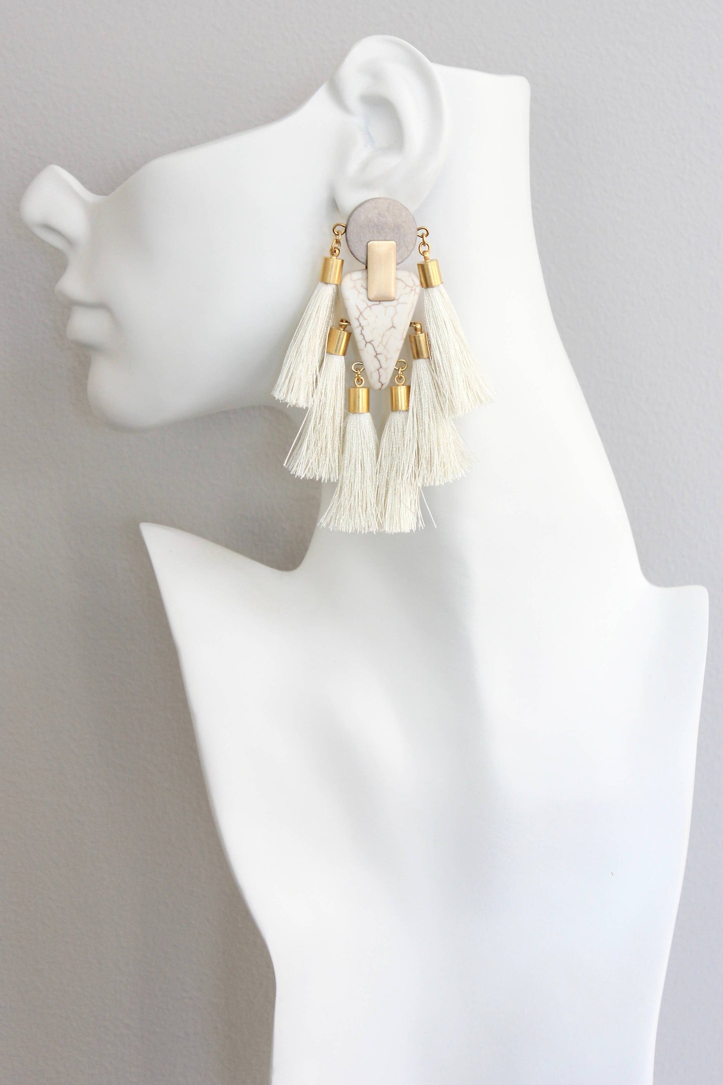 Gray and white tassel post statement earrings
