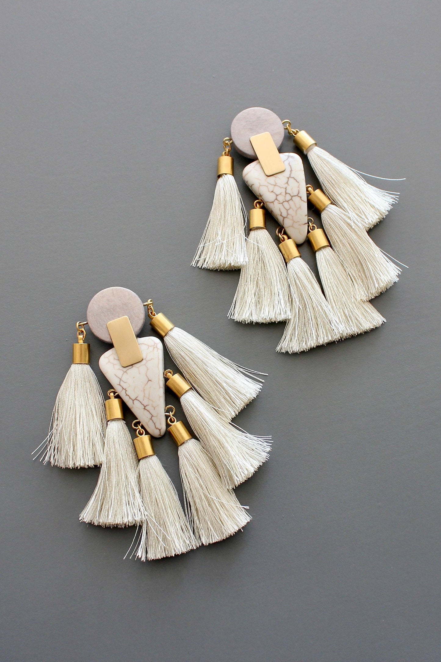Gray and white tassel post statement earrings