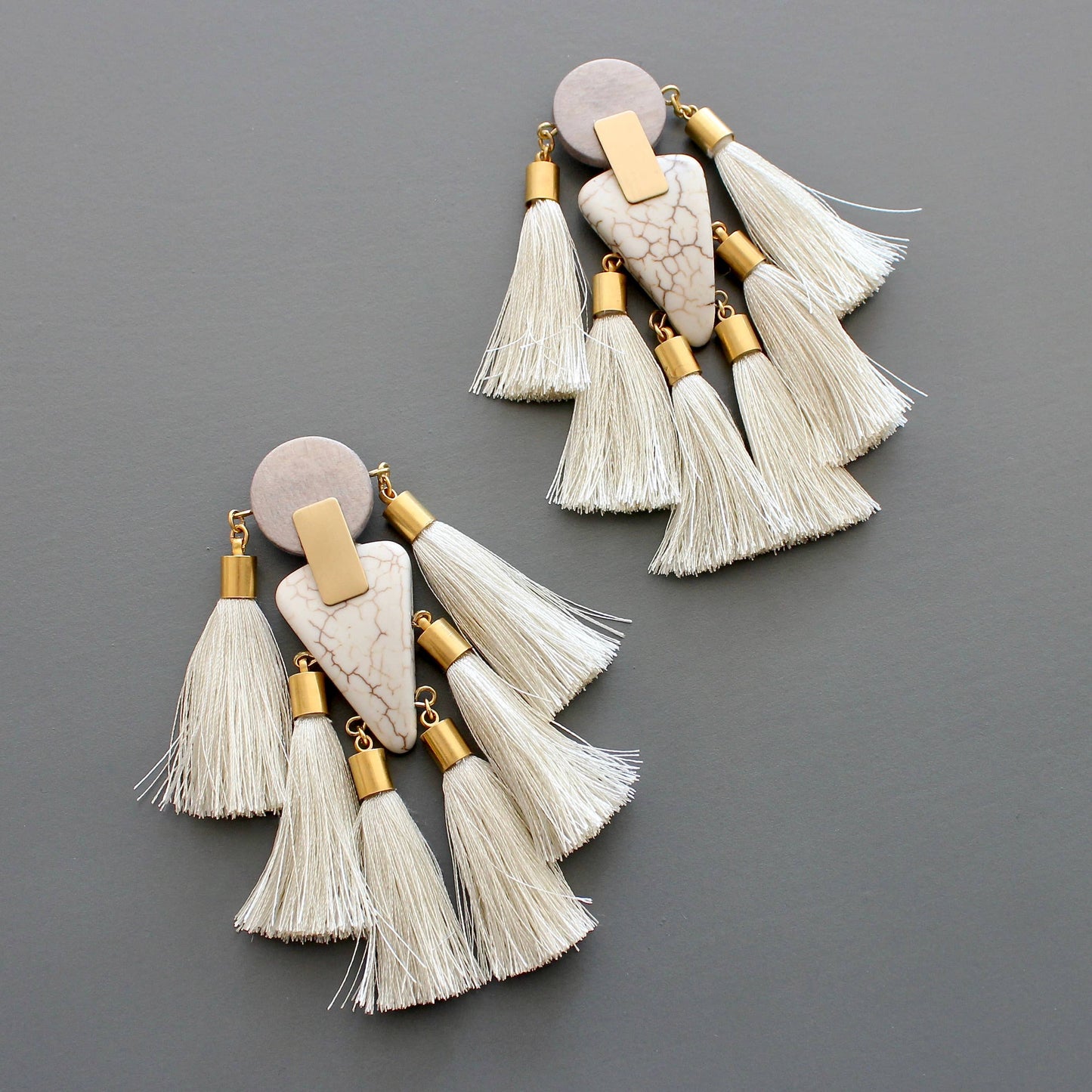 Gray and white tassel post statement earrings