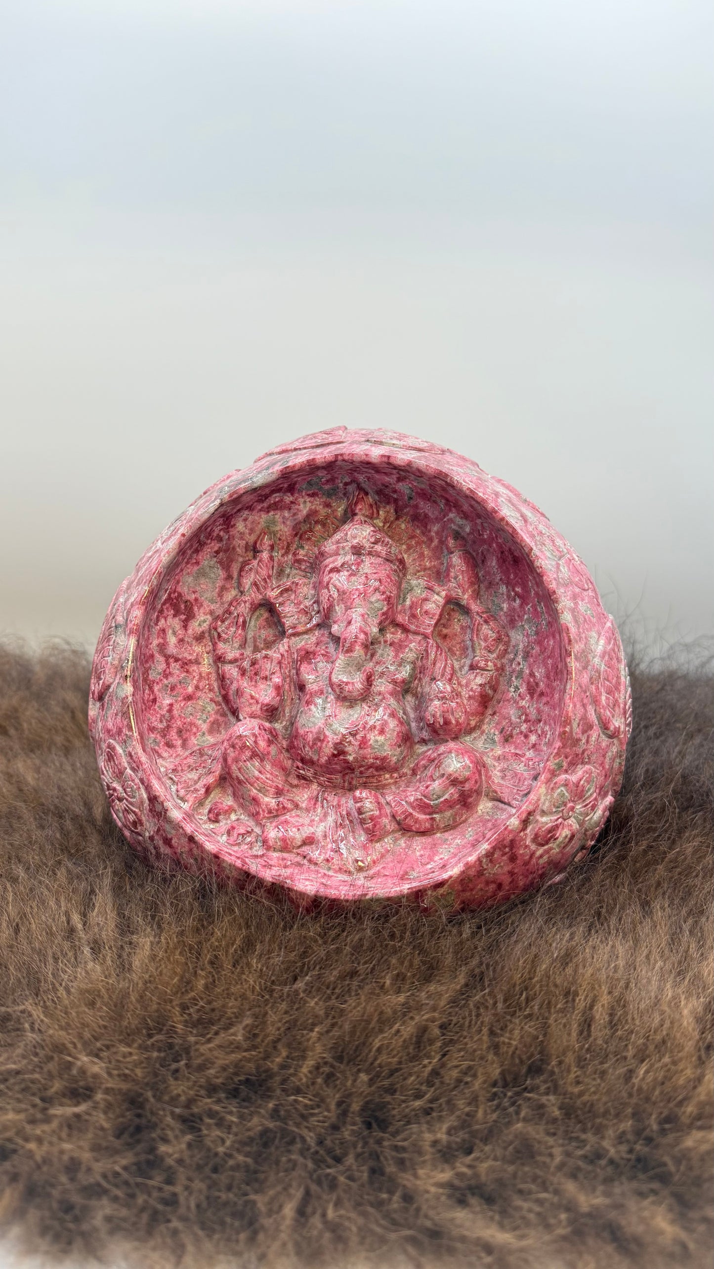 Thulite Ganesha in a cave with Intricate designs and symbols