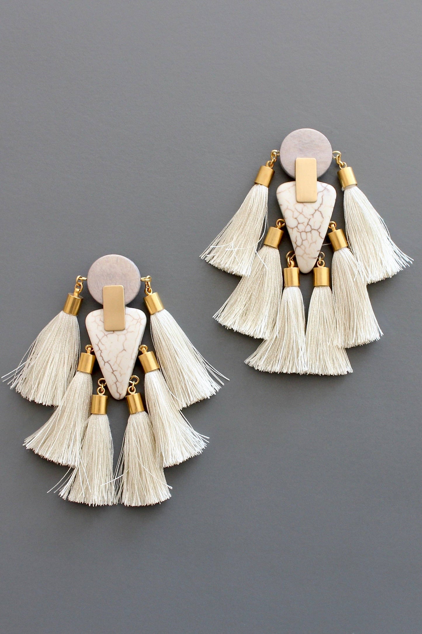 Gray and white tassel post statement earrings